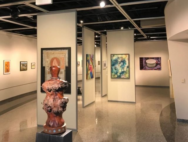 What are some reasons for investing in art